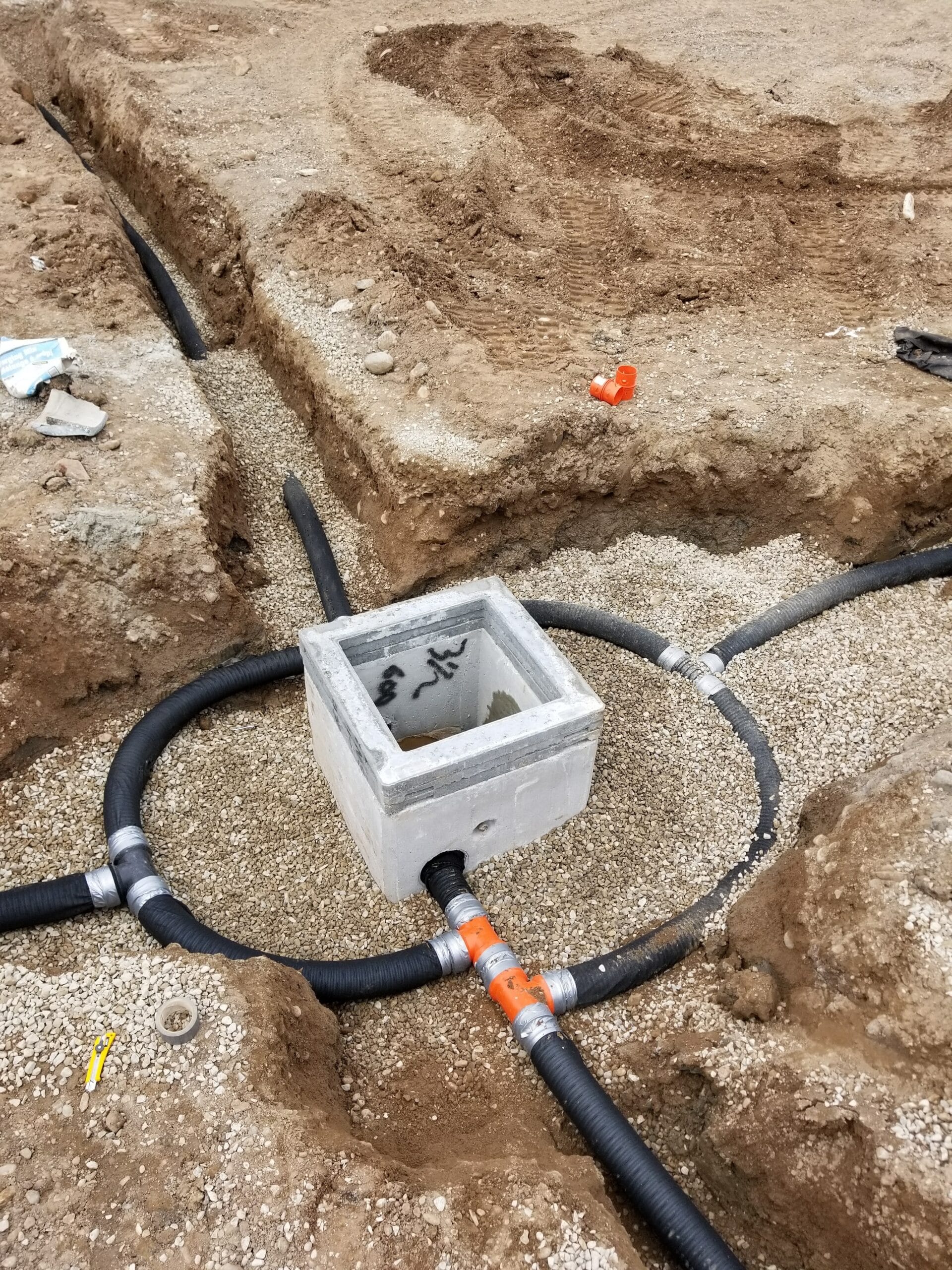 New installed storm catch basin and weeping tile for parking lot