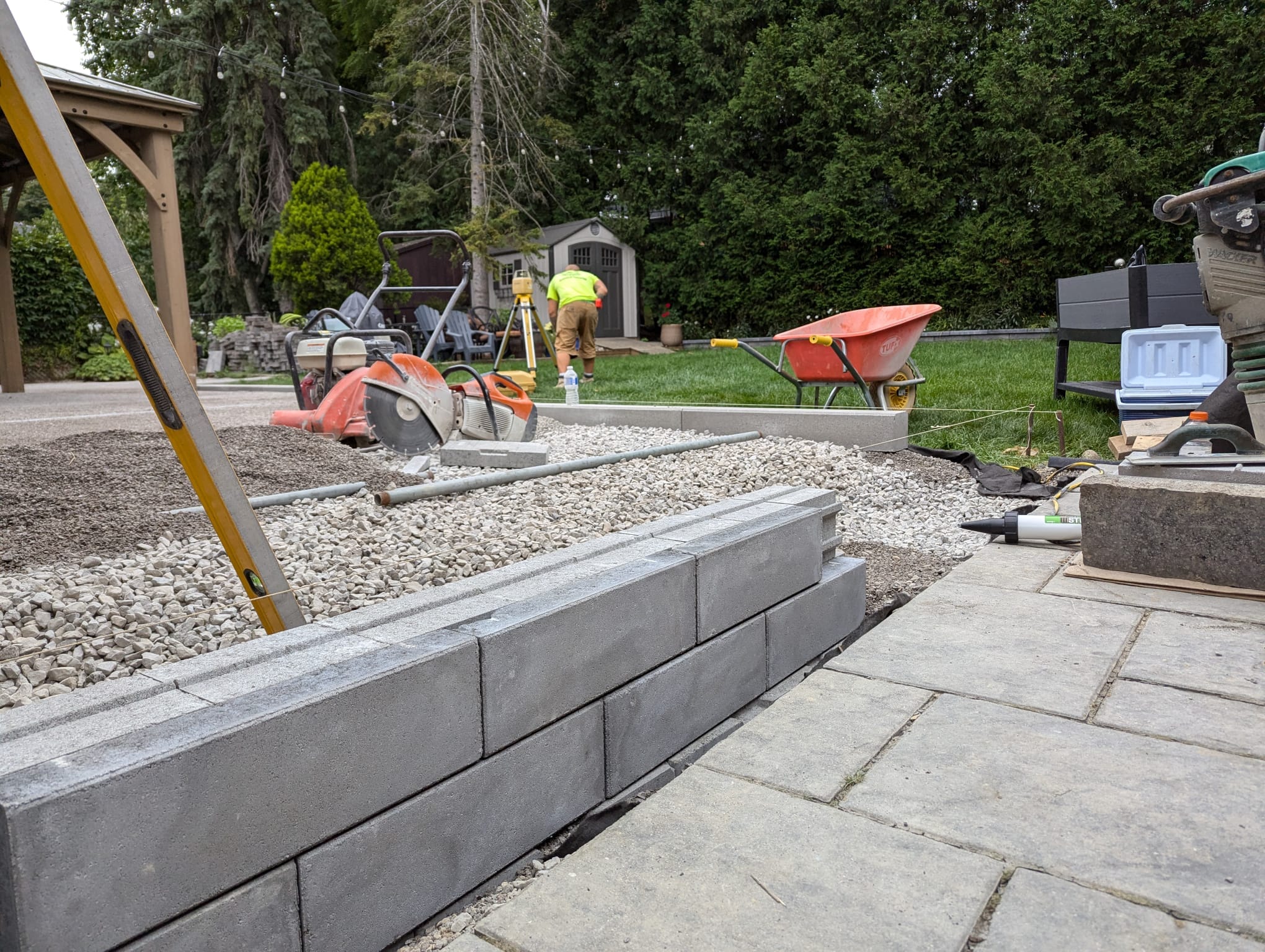 constructing the retaining wall before the interlock patio is started