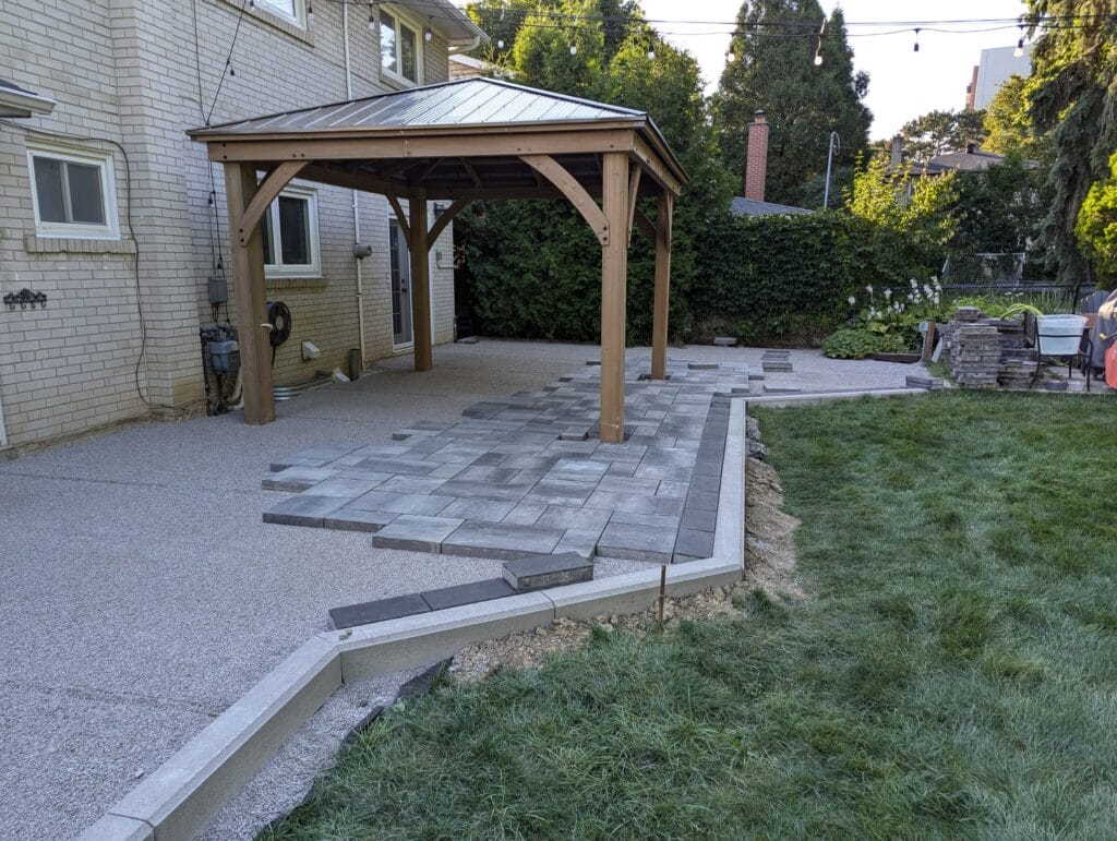 modern interlock with dark boarder going under a gazebo
