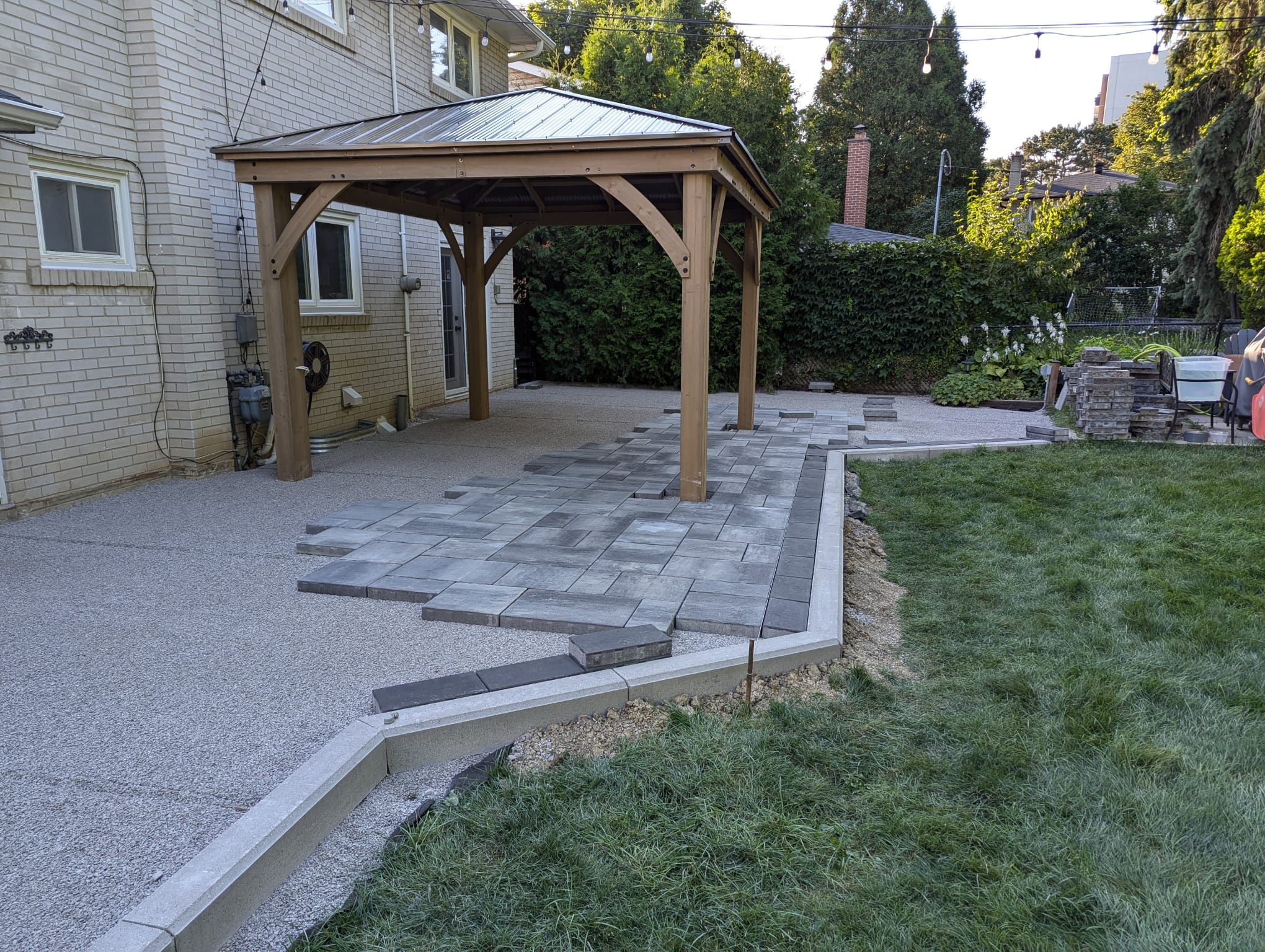 modern interlock with dark boarder going under a gazebo