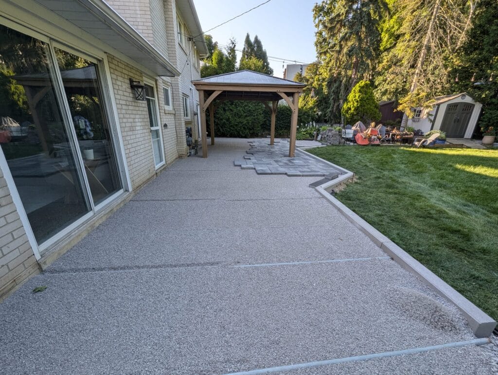 bedding layer laid down and the interlock patio is cut around the gazebo
