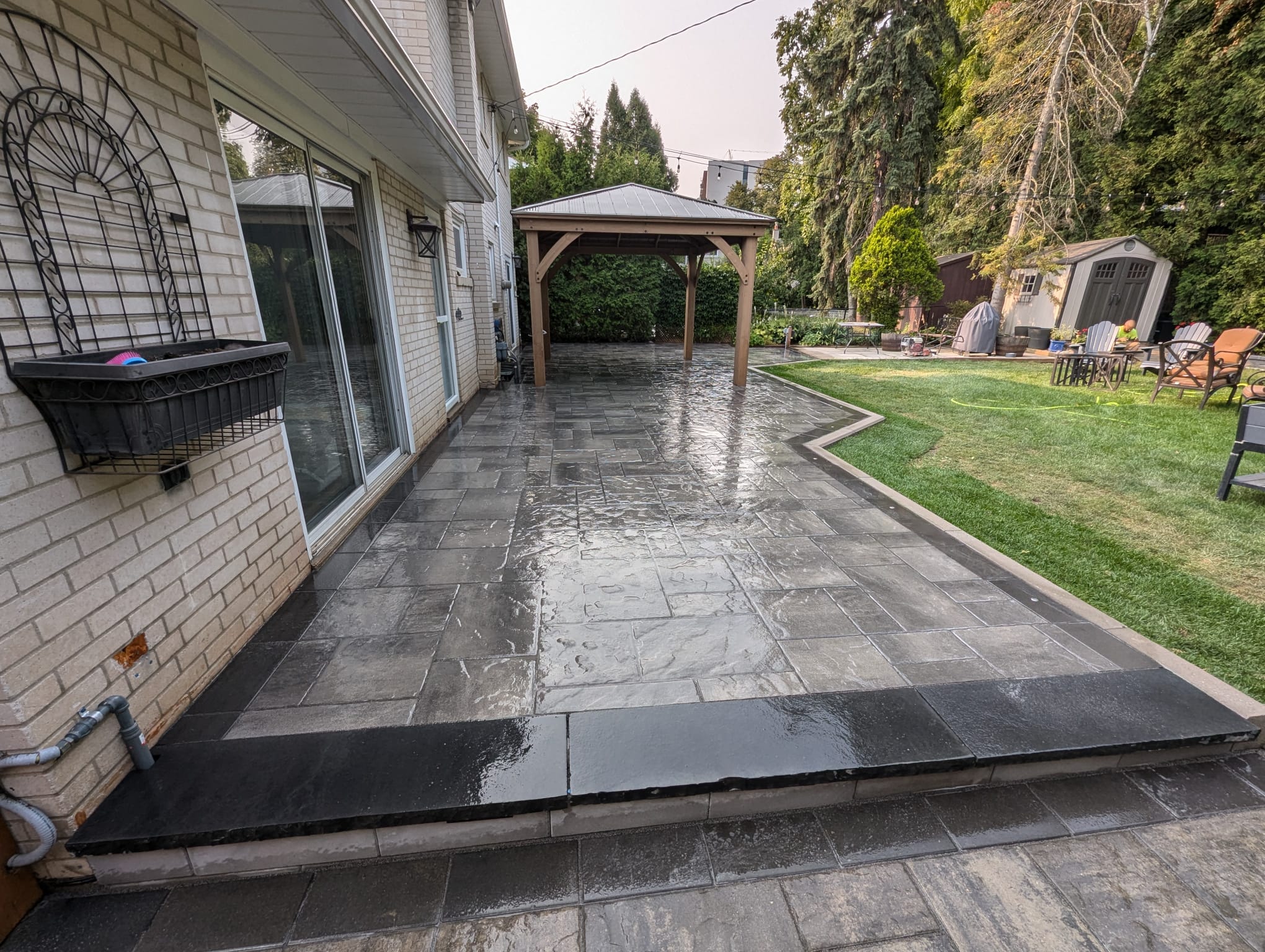 natural stone step which is going to a high end interlock backyard project