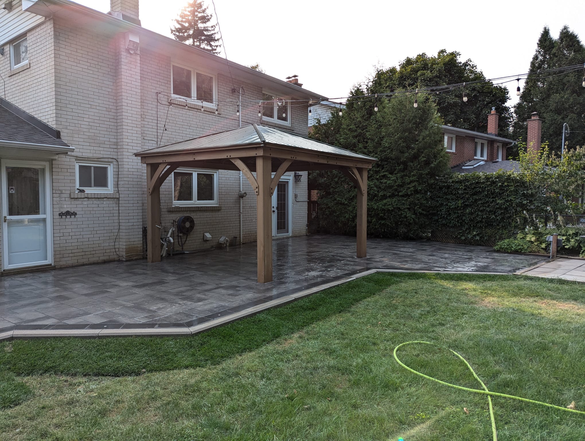 fresh sod installed around the outside of the patio