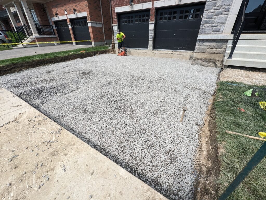clear stone installation in a driveway before interlock